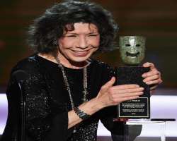 Director David O. Russell presented her Lifetime Achievement of The Women's Image Network (WIN) on his one bended knee.